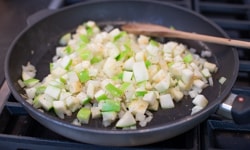 apples and onions cooking in pan