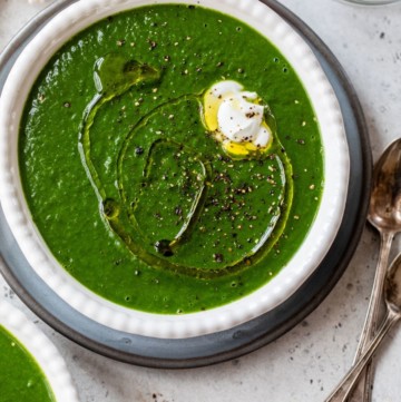 spinach soup topped with olive oil and a dollop of yogurt
