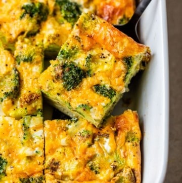 serving broccoli and cheese egg bake out of a casserole dish