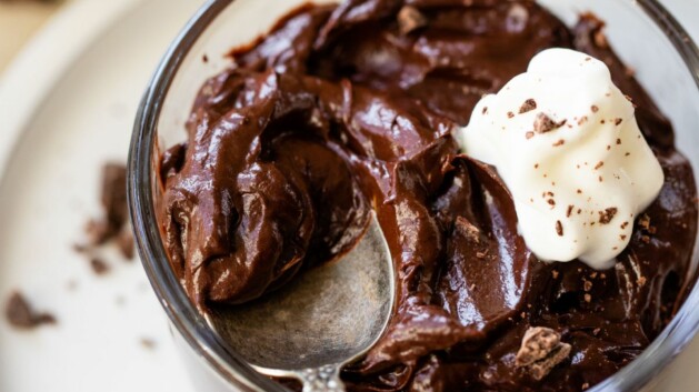 Chocolate avocado pudding with a spoonful on top.