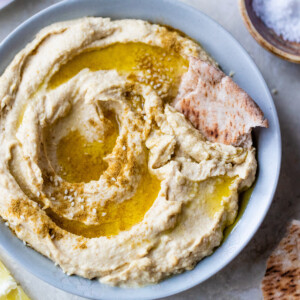 5-minute hummus with tahini in a small bowl topped with olive oil