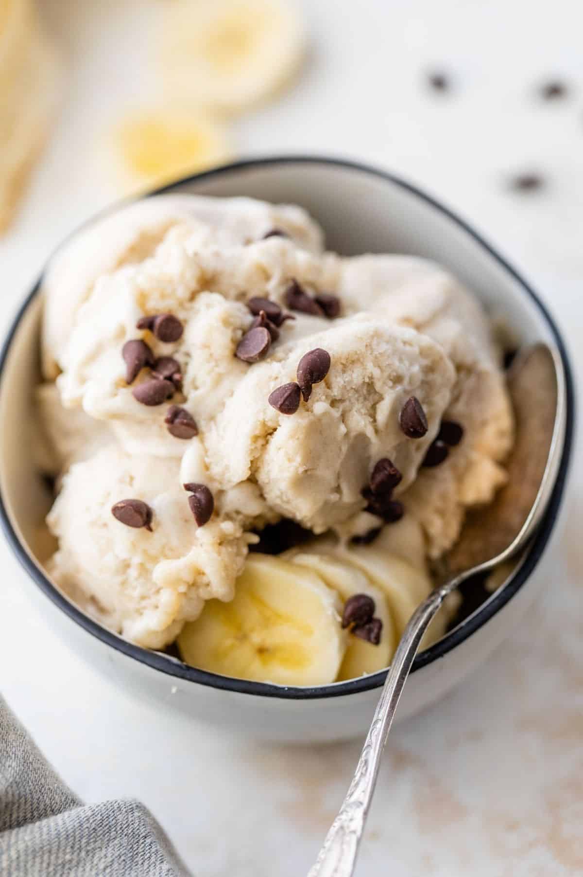 banana ice cream in a bowl topped with chocolate chips