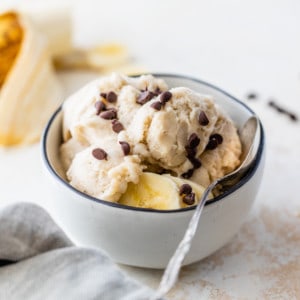 banana ice cream in a bowl topped with mini chocolate chips