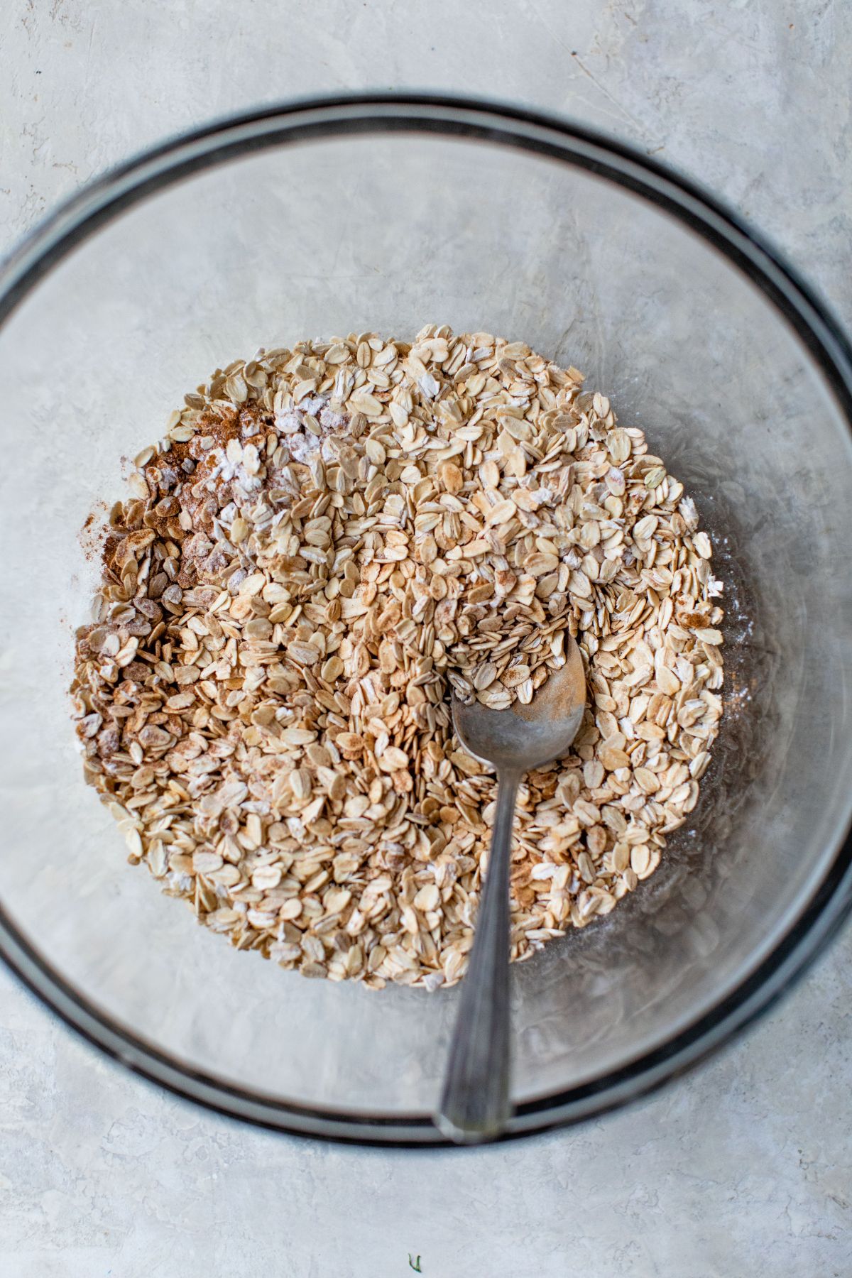 Stirring rolled oats with salt and cinnamon.