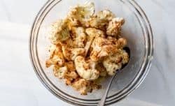 coating cauliflower florets with spices
