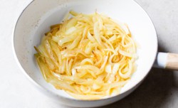 sauteed onions in white pan