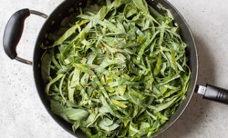 collard ribbons with red pepper flakes in pan