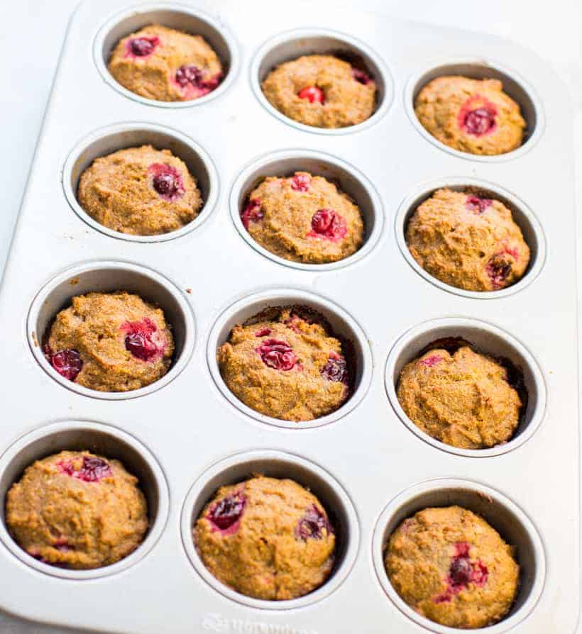 Pumpkin Cranberry Muffins in a muffin tin