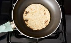 cooking tortillas in a skillet