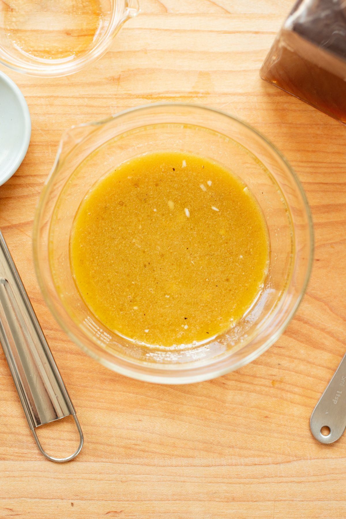 Basic vinaigrette made in a small glass dish.