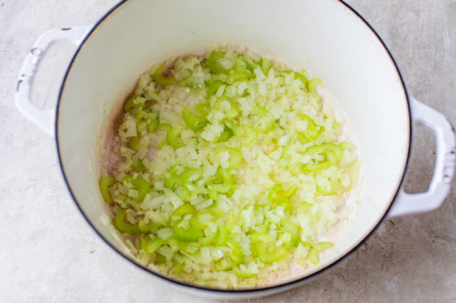 onion and celery sauteed in a large white pot