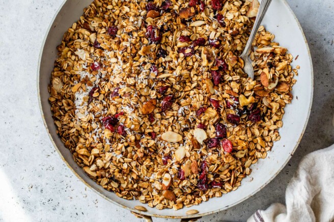Granola in a pan with cranberries.
