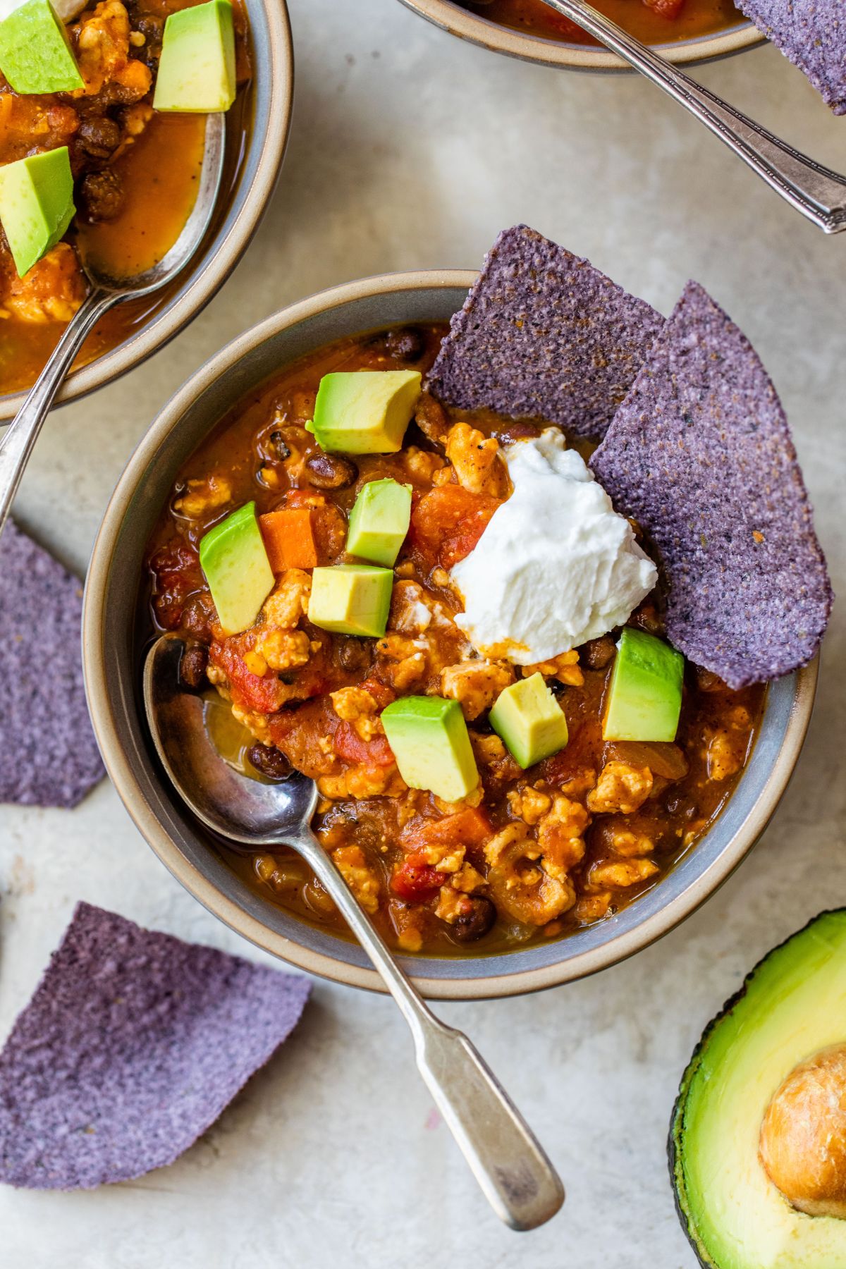 Turkey Pumpkin Chili served with avocado and tortilla chips.