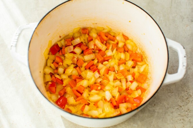 Cooking diced veggies in a pot.
