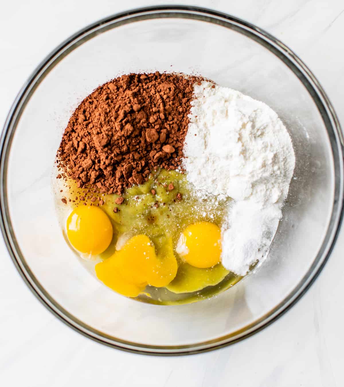 eggs, coconut flour and cacao powder in a bowl