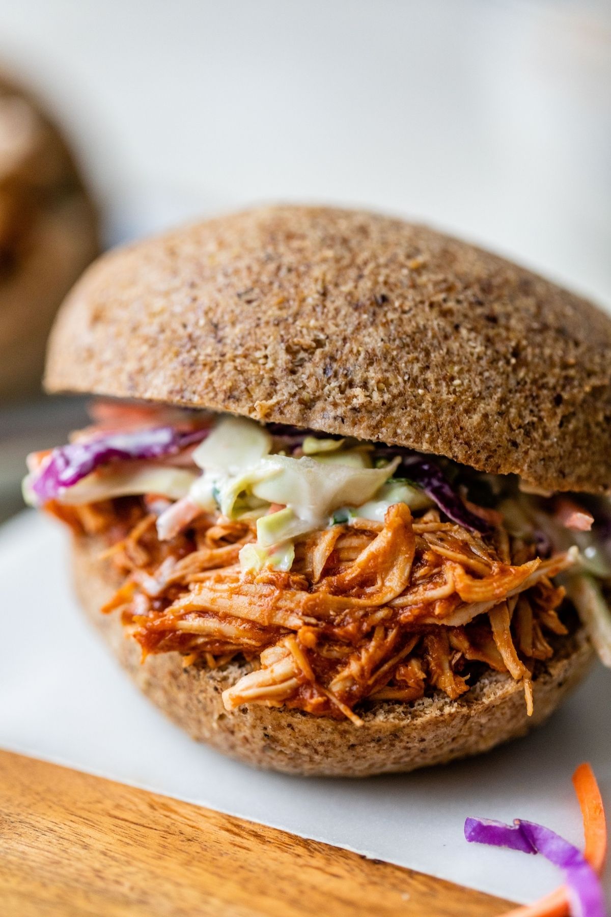BBQ chicken and coleslaw on a bun.