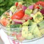 simple avocado and tomato salad with red onions and fresh herbs