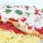chicken parm served on spaghetti with cheese