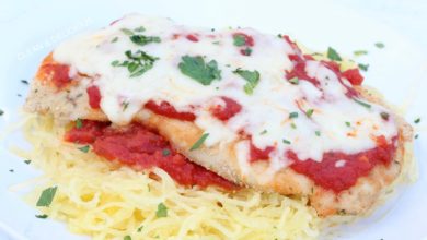 chicken parm served on spaghetti with cheese