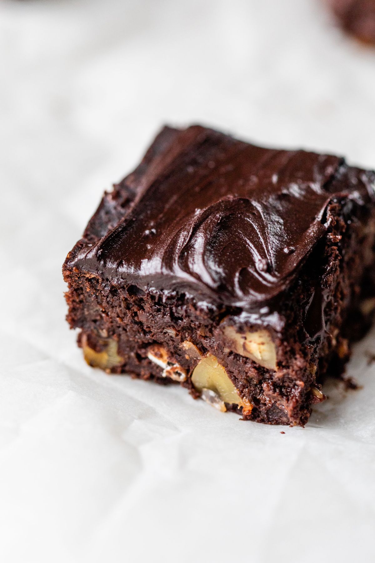 Black bean brownie with icing and nuts.