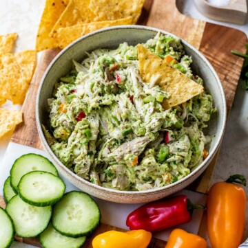 Avocado chicken salad served with tortilla chips and freshly cut veggies.