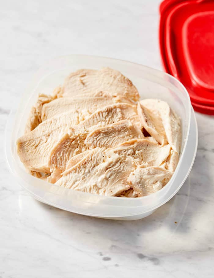 sliced chicken breast in a container 