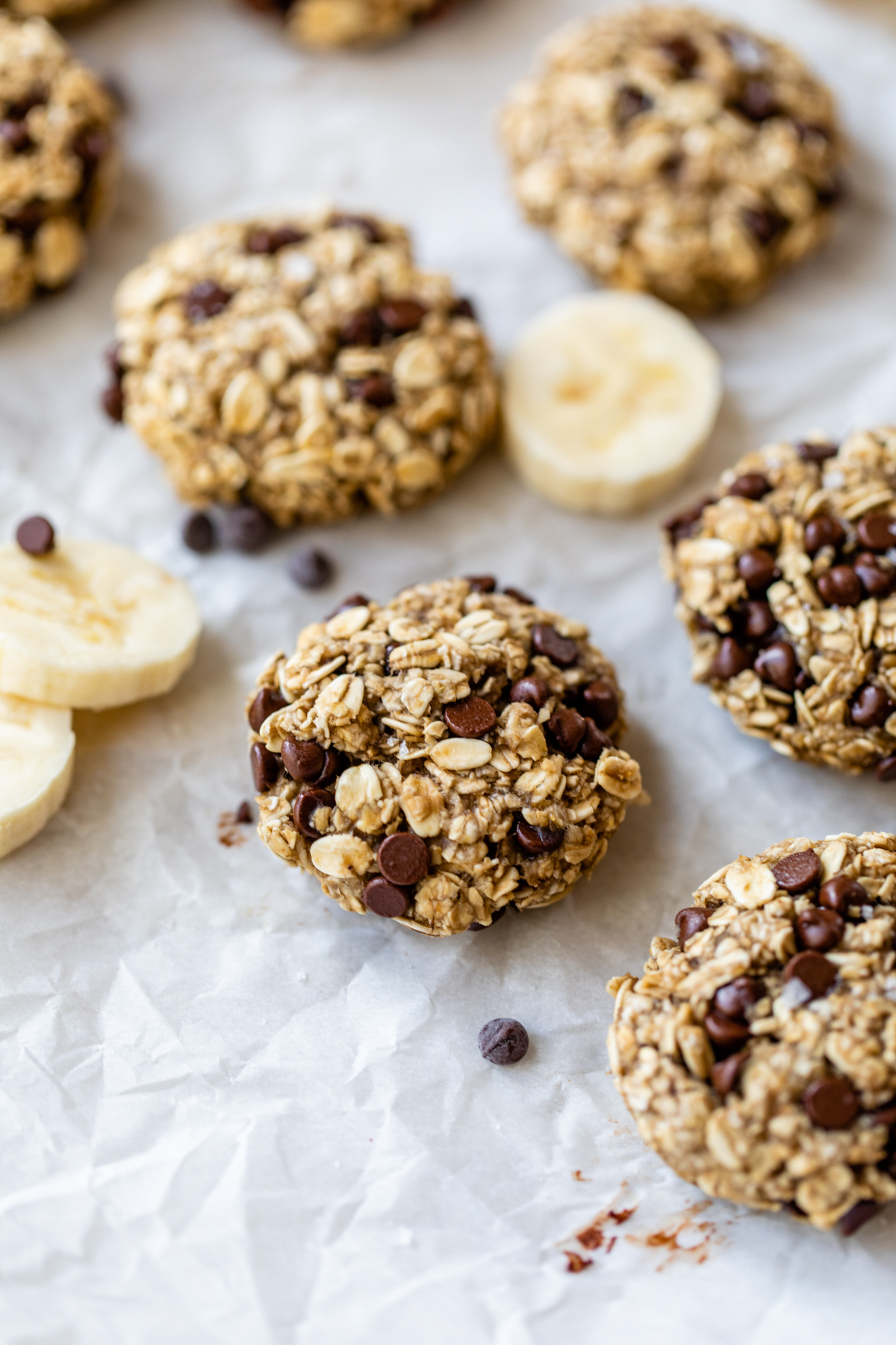 banana oat cookies on white parchment paper
