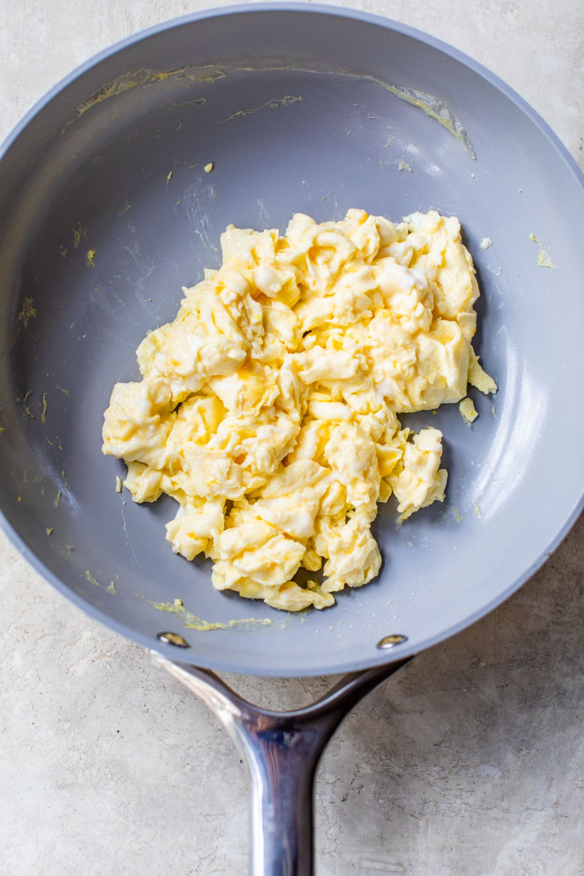 Scrambled eggs in a pan.