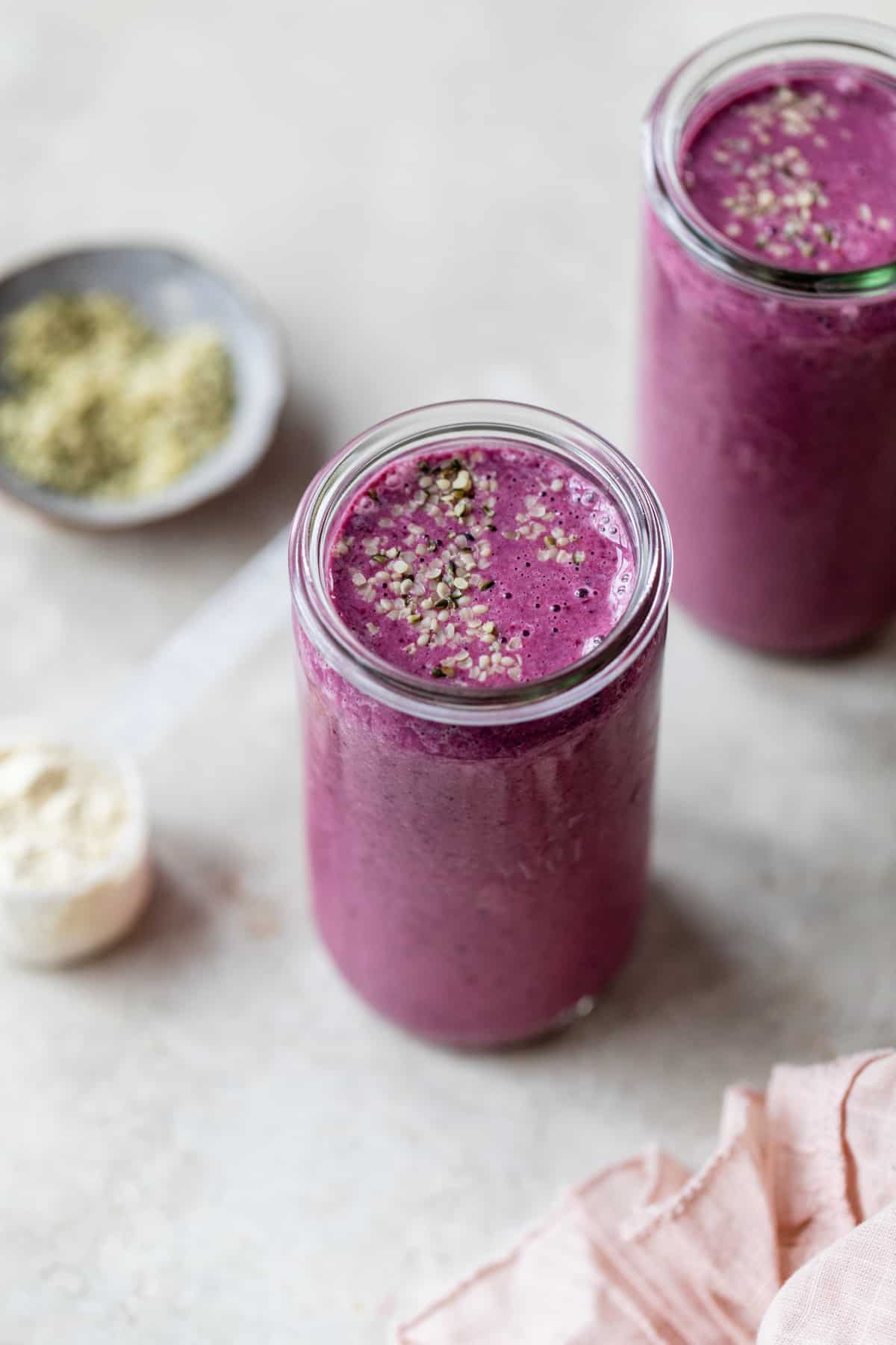 berry and hemp seed smoothie in glass jar