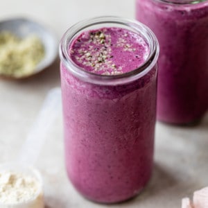 mixed berry hemp seed smoothie in a mason jar
