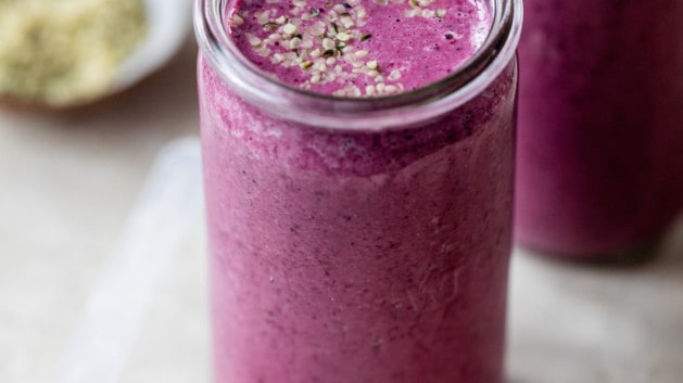 mixed berry hemp seed smoothie in a mason jar