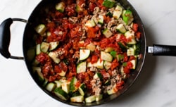 zucchini and tomatoes added to skillet with ground turkey