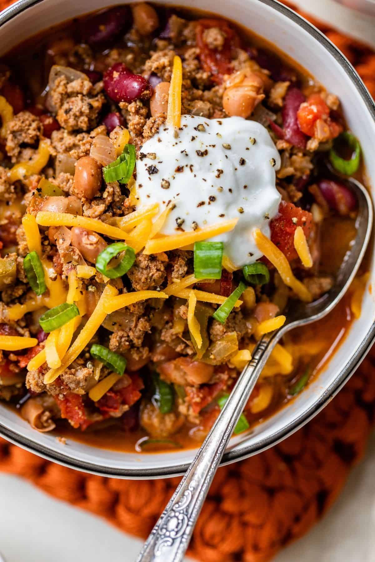chili served with cheese and sour cream
