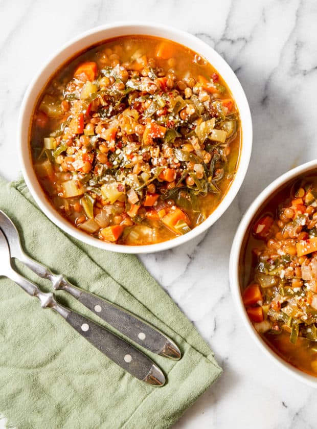 an easy one pot lentil soup recipe served in bowls with spoons