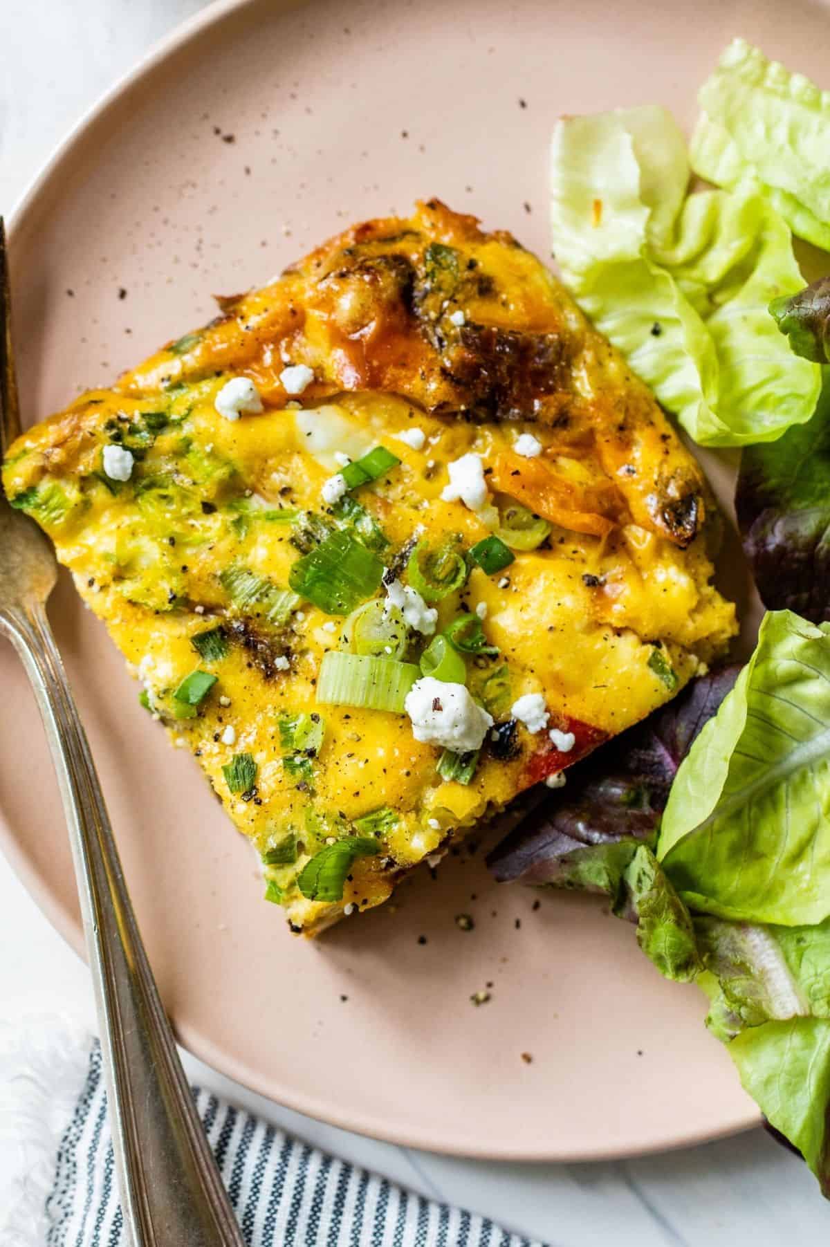 slice of frittata served with a salad 