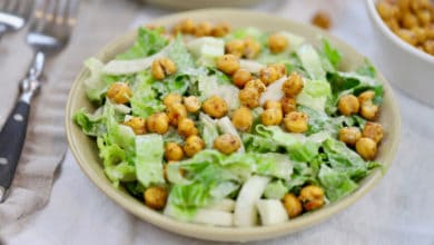caesar salad topped with roasted chickpeas on a linen napkin