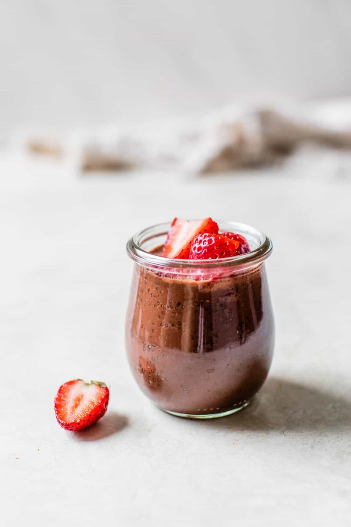 chocolate chia seed pudding topped with strawberries