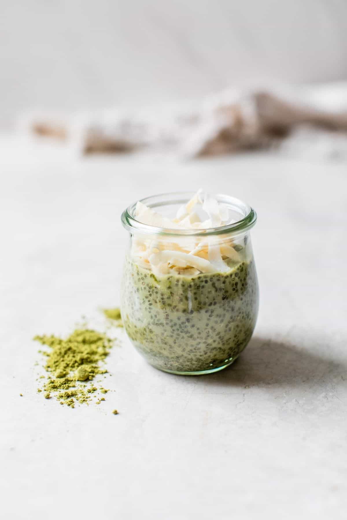 matcha coconut chia seed pudding in a glass jar