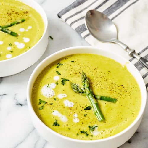 asparagus soup in white bowls