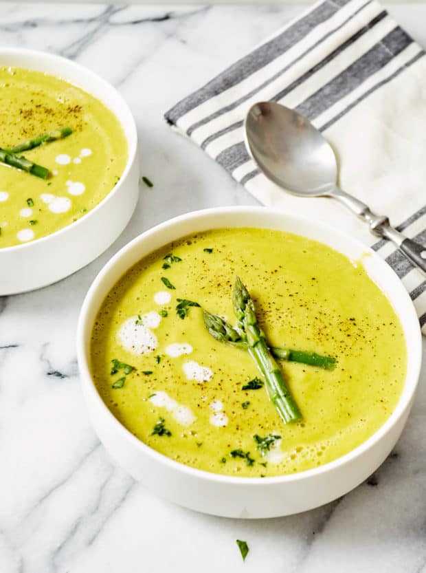 asparagus soup in white bowls