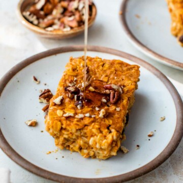 Drizzling syrup on a serving of baked pumpkin oatmeal.