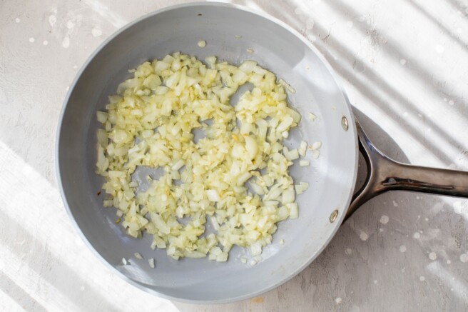 Sautéed onion in a pan.