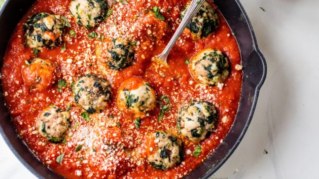 turkey spinach meatballs in skillet with tomato sauce