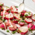 roasted radishes drizzled with lemon tahini sauce