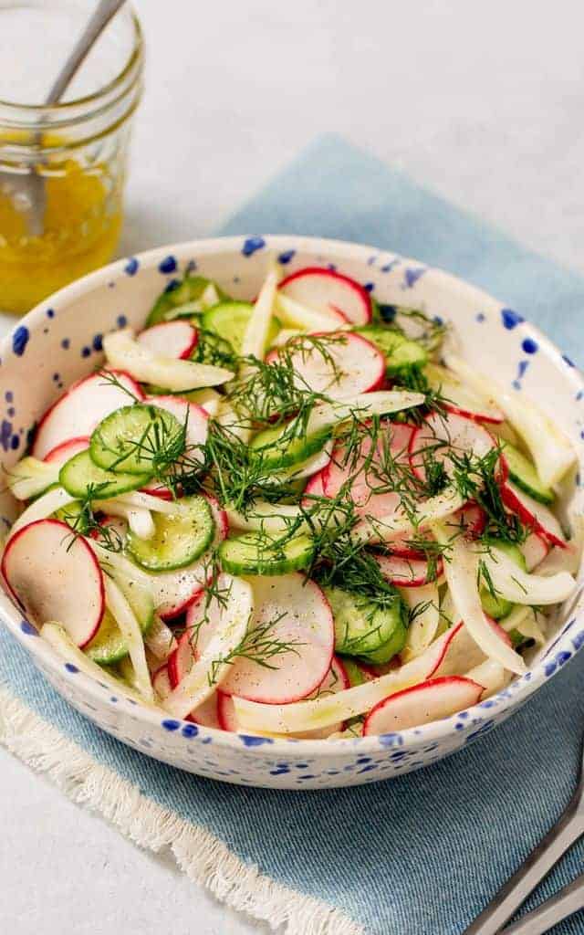 radish salad with fennel and cucumber and topped with dill