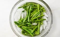 green beans in a bowl with ice