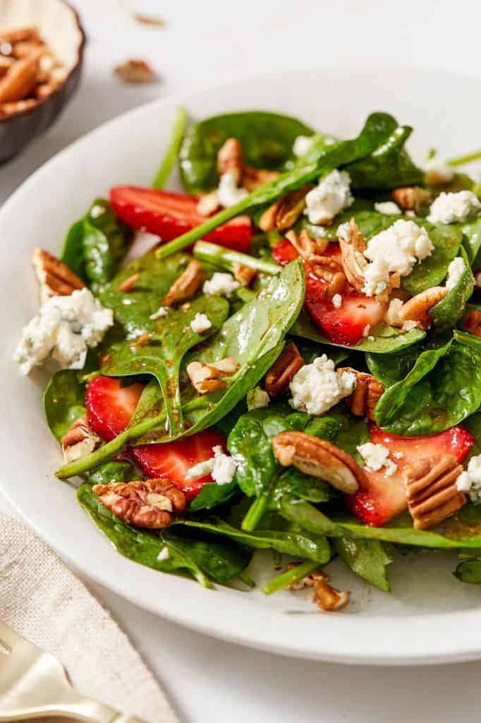 strawberry spinach salad tossed in a balsamic vinaigrette