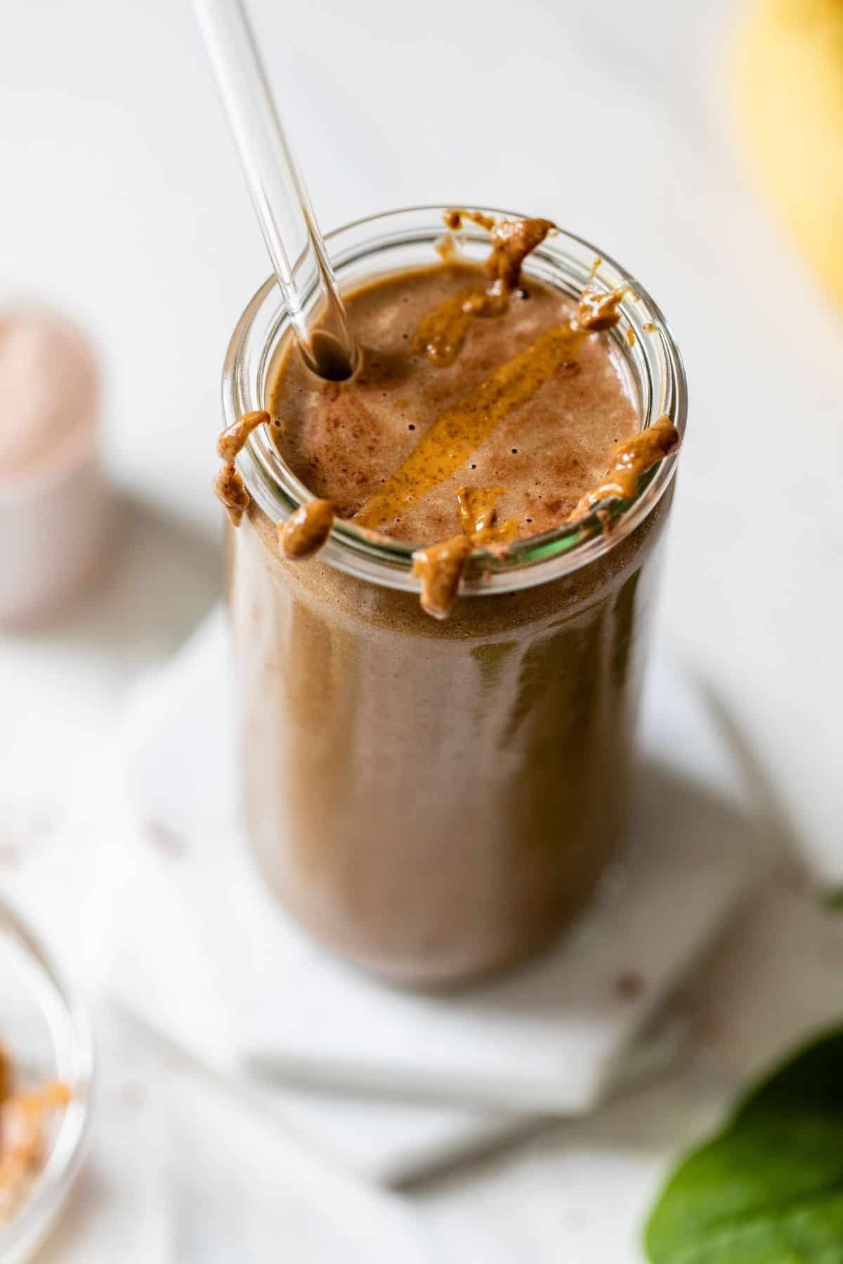 chocolate protein shake topped with almond butter