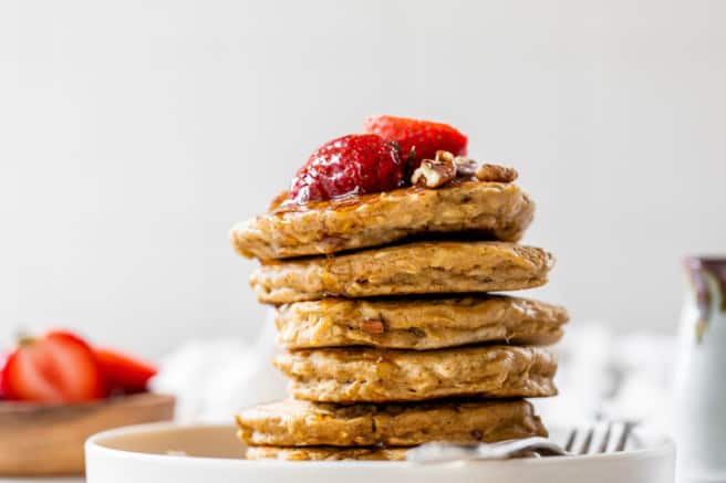 cooked oatmeal pancakes topped with berries