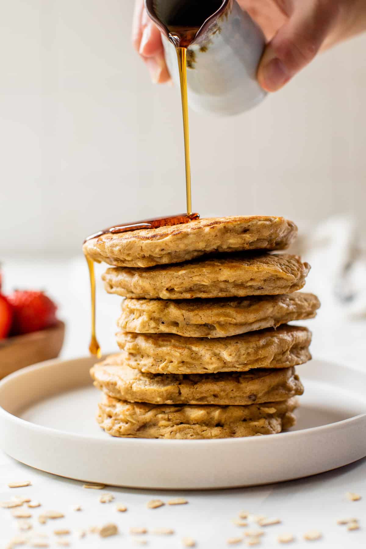 oatmeal pancake stacked on a white plate